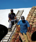 workmen tiling salt pile 11oct17ab